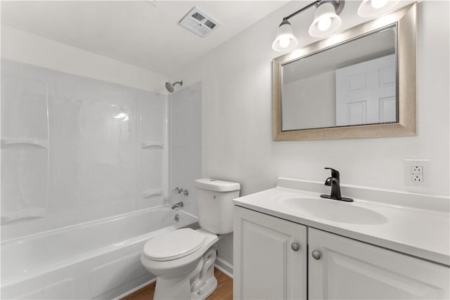 full bath featuring toilet,  shower combination, visible vents, vanity, and wood finished floors