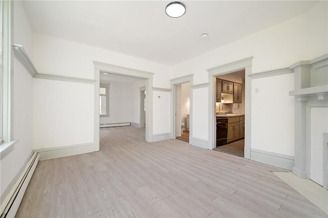 301 N Monroe St, City Of But Ne, PA 16001 - unfurnished living room featuring light wood-style flooring, baseboards, and baseboard heating