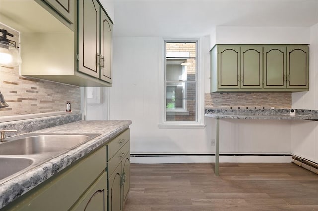 301 N Monroe St, City Of But Ne, PA 16001 - kitchen featuring a sink, green cabinets, dark wood-style floors, and backsplash