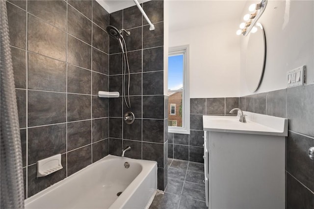 301 N Monroe St, City Of But Ne, PA 16001 - bathroom featuring tile walls, vanity, and washtub / shower combination