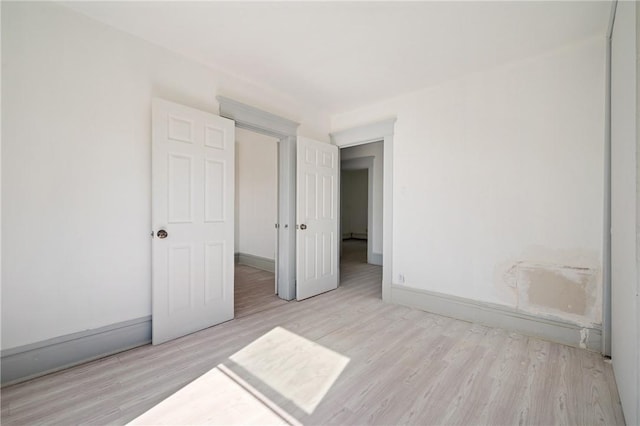 301 N Monroe St, City Of But Ne, PA 16001 - unfurnished bedroom featuring wood finished floors and baseboards