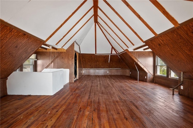 301 N Monroe St, City Of But Ne, PA 16001 - additional living space with wood walls, lofted ceiling, and hardwood / wood-style floors