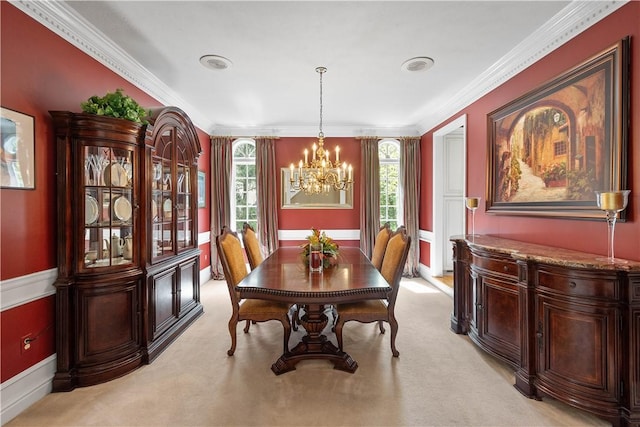 dining area featuring light carpet, an inviting chandelier, and crown molding