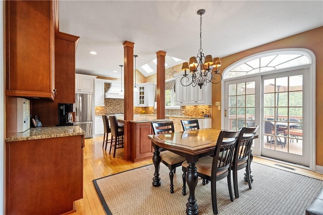dining room with recessed lighting, visible vents, decorative columns, a chandelier, and light wood-style floors