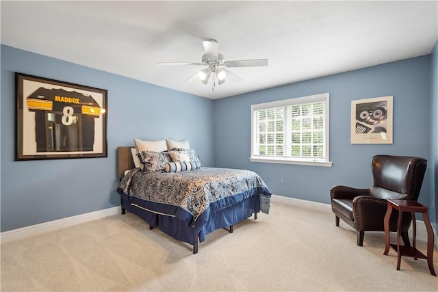 bedroom with baseboards, a ceiling fan, and carpet