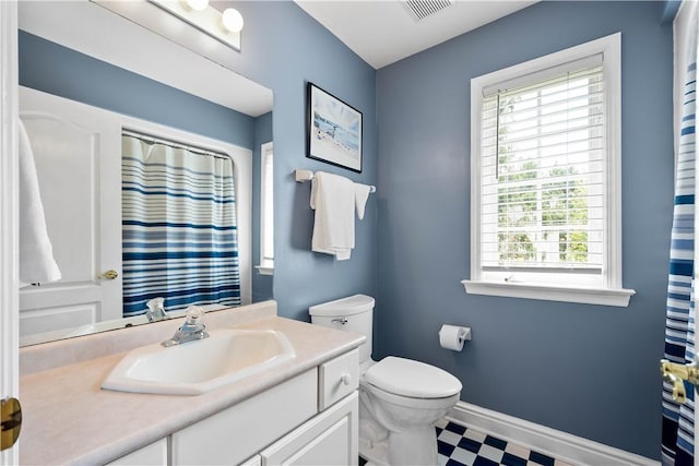 full bathroom featuring toilet, tile patterned floors, visible vents, baseboards, and vanity