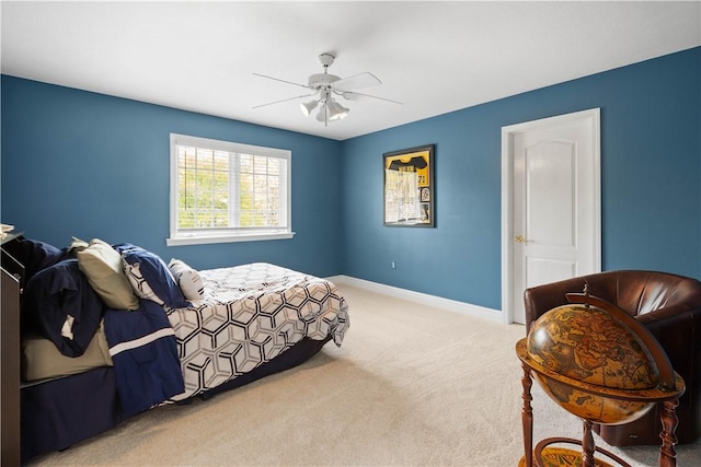 bedroom featuring baseboards, ceiling fan, and carpet floors