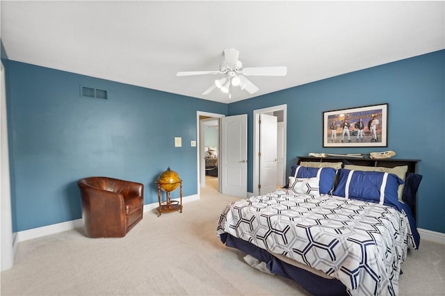 bedroom featuring baseboards, a ceiling fan, visible vents, and carpet floors