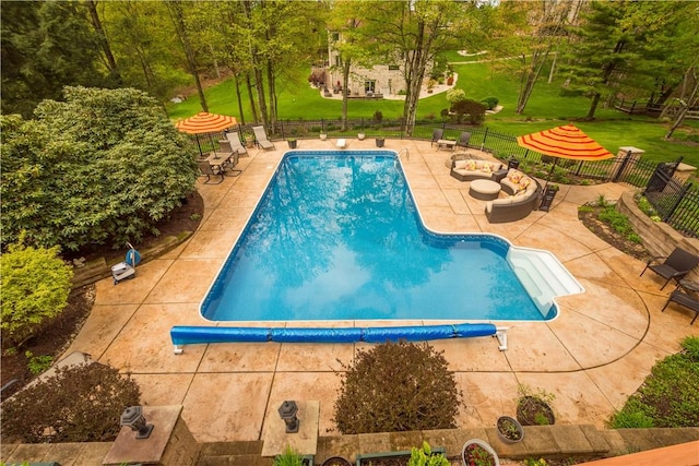 view of pool with a patio, fence, and a fenced in pool