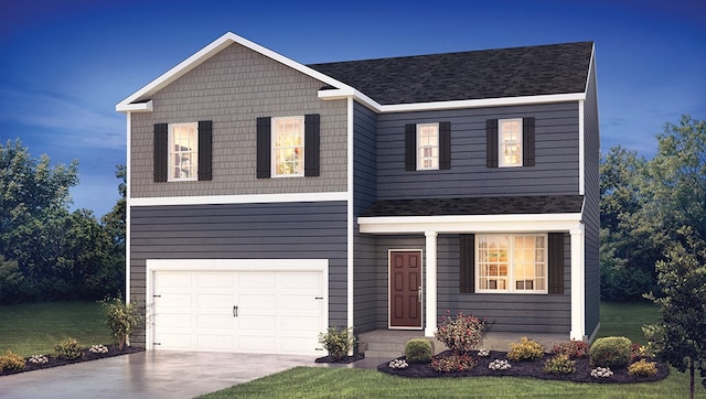 view of front of house featuring a front lawn, driveway, and an attached garage