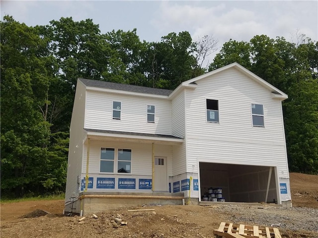 240 Crabapple Ln, North Sewickley Twp, PA 15010 - view of front facade with a garage, covered porch, driveway, and view of wooded area