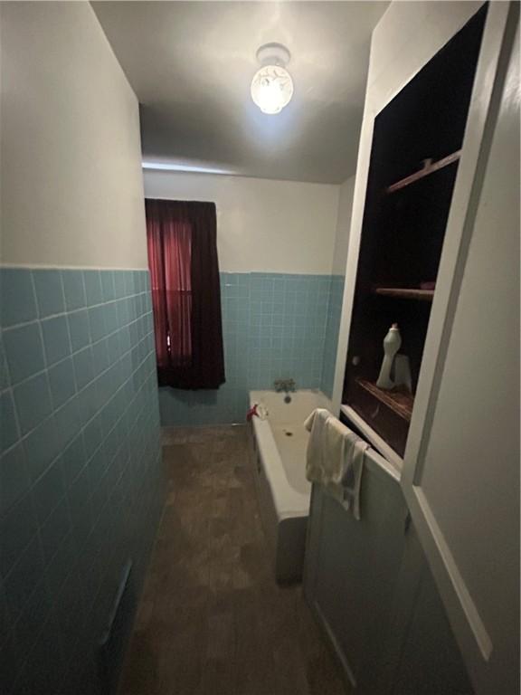 116 Ivy St, Wilkins Twp, PA 15145 - full bathroom featuring tile walls, a garden tub, and a wainscoted wall