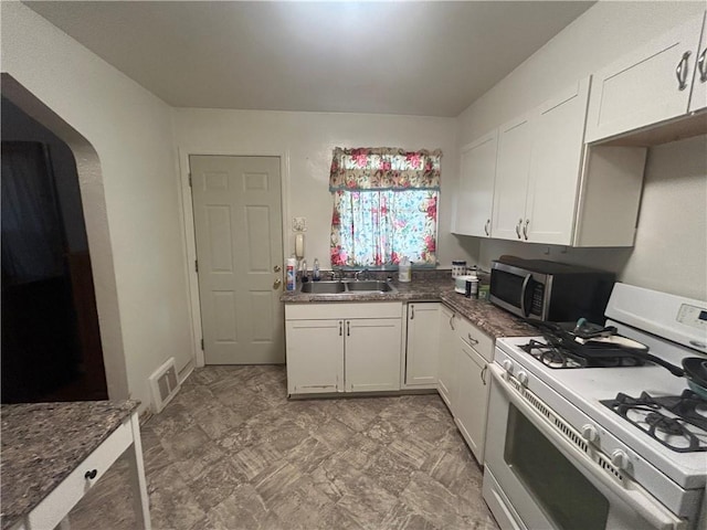116 Ivy St, Wilkins Twp, PA 15145 - kitchen featuring white cabinetry, white range with gas stovetop, visible vents, and stainless steel microwave