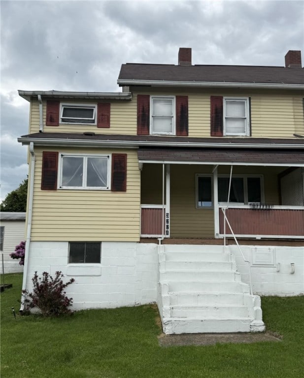 48 2nd St, Dunbar Twp, PA 15431 - view of front of home with a front lawn, a porch, a chimney, and stairs