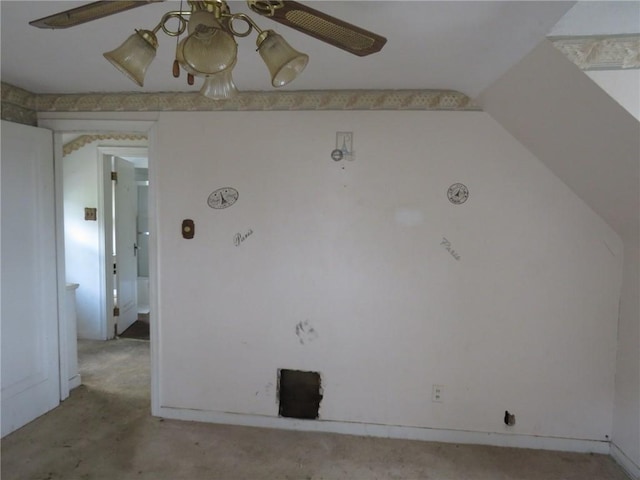unfurnished room with light colored carpet and a ceiling fan
