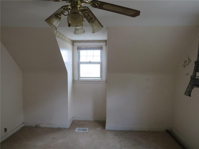 bonus room featuring light colored carpet, ceiling fan, baseboards, and visible vents