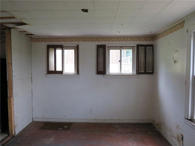 unfurnished room featuring plenty of natural light