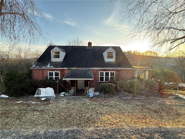 39 Eagle St, Fallowfield, PA 15022 - rear view of house with a chimney, brick siding, and a shingled roof