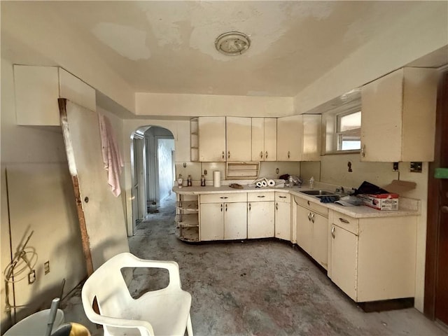39 Eagle St, Fallowfield, PA 15022 - kitchen with a sink, open shelves, light countertops, and arched walkways