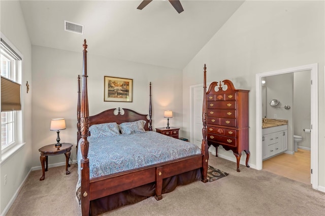 bedroom featuring multiple windows, visible vents, and light colored carpet