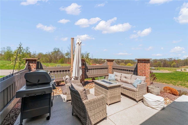 view of patio with outdoor lounge area and grilling area