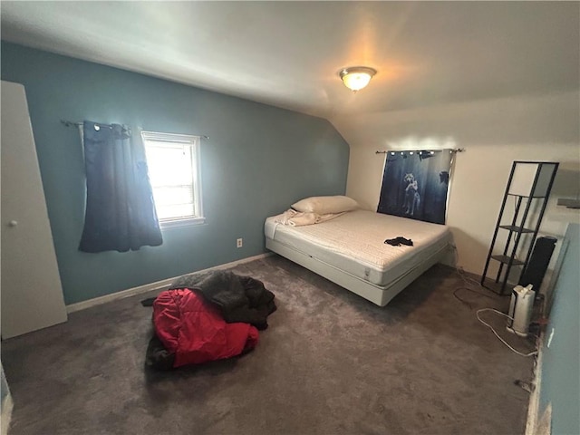 carpeted bedroom featuring vaulted ceiling