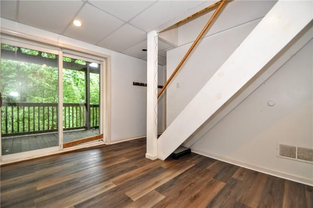 below grade area with wood finished floors, baseboards, stairs, and recessed lighting