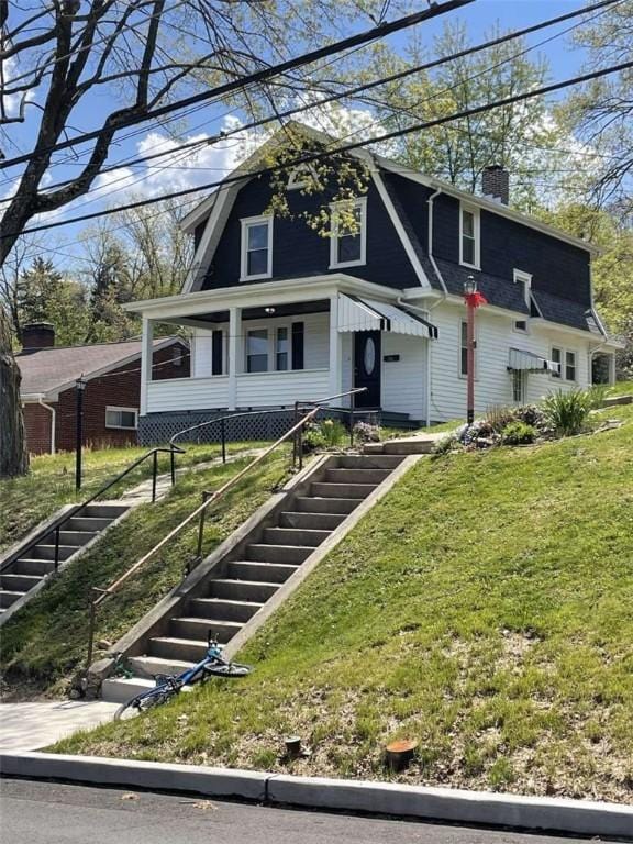 846 Neely Heights Ave, Coraopolis, PA 15108 - colonial inspired home with a front lawn, stairway, a chimney, and a gambrel roof