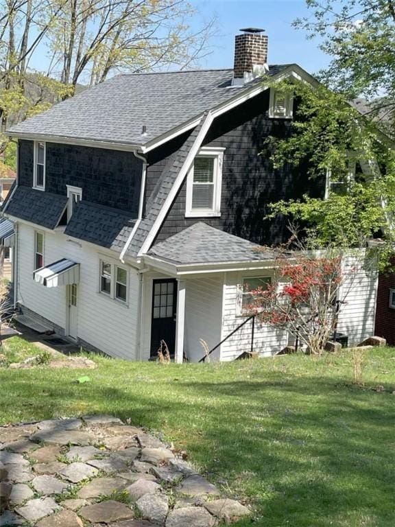 846 Neely Heights Ave, Coraopolis, PA 15108 - back of house featuring a shingled roof, a yard, and a chimney