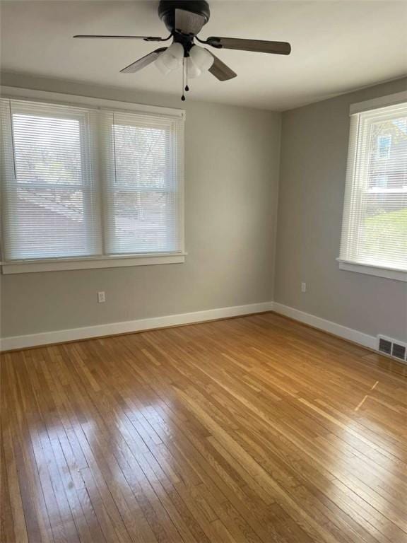 846 Neely Heights Ave, Coraopolis, PA 15108 - empty room featuring wood-type flooring, baseboards, a ceiling fan, and visible vents
