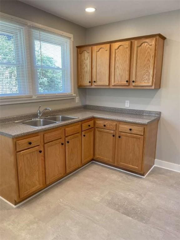 846 Neely Heights Ave, Coraopolis, PA 15108 - kitchen with recessed lighting, baseboards, brown cabinets, and a sink