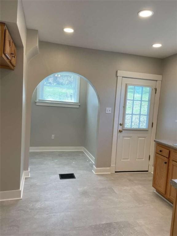 846 Neely Heights Ave, Coraopolis, PA 15108 - doorway with visible vents, baseboards, a healthy amount of sunlight, and arched walkways