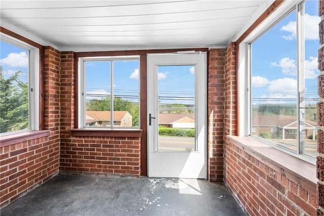 3606 Churchview Ave, Baldwin Boro, PA 15236 - unfurnished sunroom with brick wall, concrete flooring, and plenty of natural light