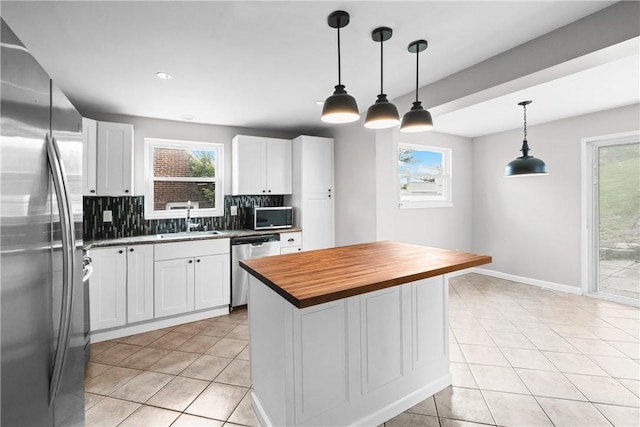 3606 Churchview Ave, Baldwin Boro, PA 15236 - kitchen featuring a sink, white cabinets, wood counters, tasteful backsplash, and appliances with stainless steel finishes