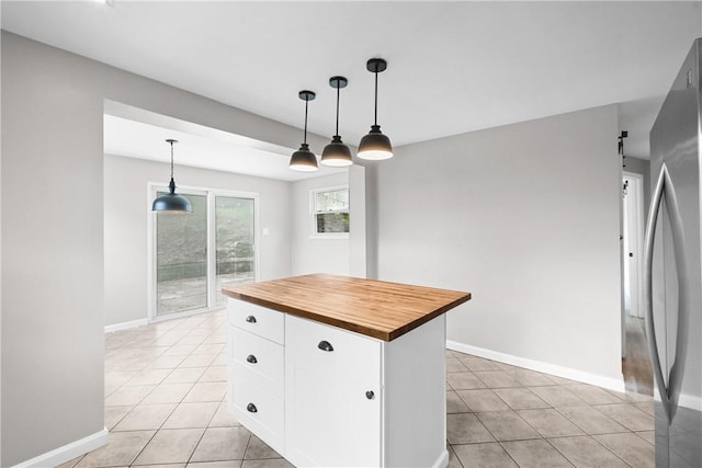 3606 Churchview Ave, Baldwin Boro, PA 15236 - kitchen with wood counters, light tile patterned floors, freestanding refrigerator, and white cabinets