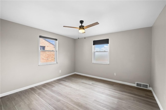 3606 Churchview Ave, Baldwin Boro, PA 15236 - empty room featuring ceiling fan, a healthy amount of sunlight, visible vents, and wood finished floors