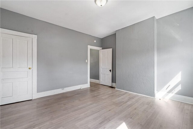 5126 Blair St, Hazelwood, PA 15207 - unfurnished bedroom featuring wood finished floors and baseboards