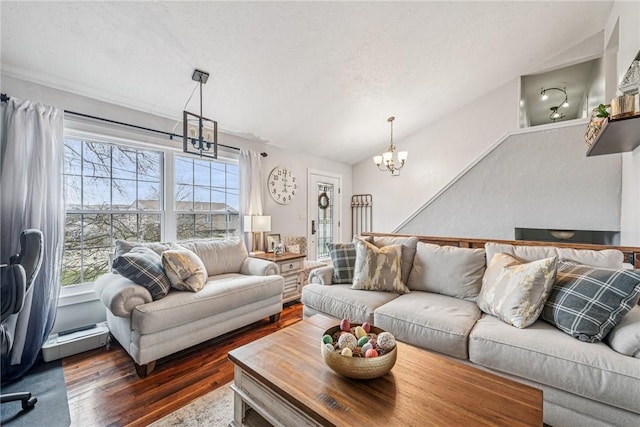 living room with an inviting chandelier, a textured ceiling, dark wood-style flooring, and a baseboard radiator