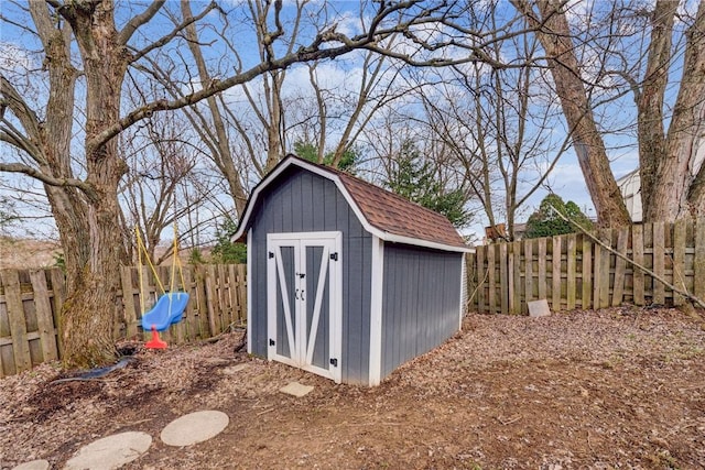 view of shed with a fenced backyard