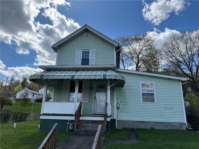 view of front of home featuring covered porch, a front lawn, and crawl space