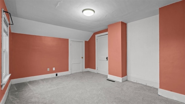 bonus room featuring vaulted ceiling, baseboards, and carpet floors
