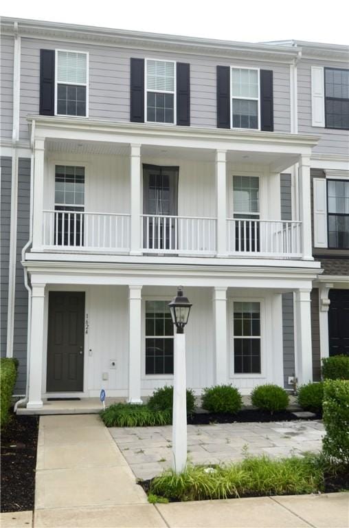 view of front facade featuring a balcony and a porch