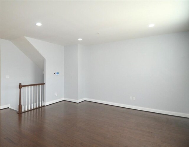 bonus room featuring recessed lighting, baseboards, and dark wood-style floors