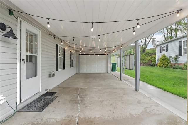 view of patio featuring a garage and a carport