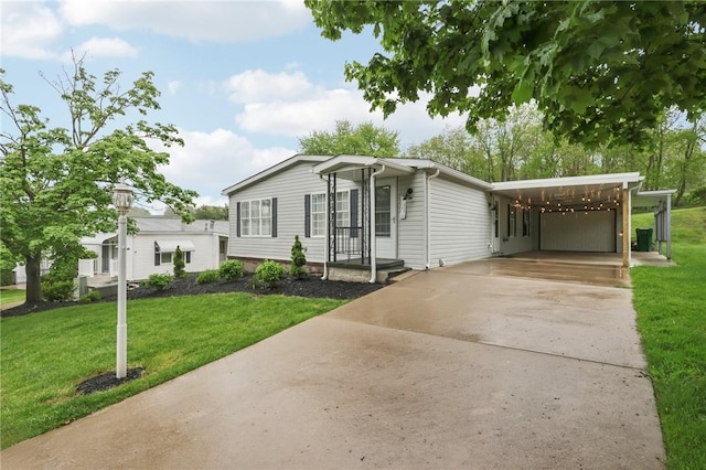 view of front facade with concrete driveway, an attached carport, and a front lawn