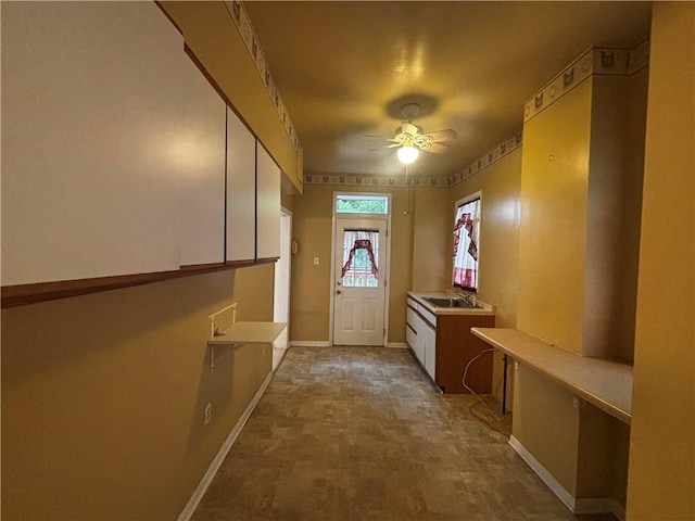636 Lincoln Ave, East Liberty, PA 15206 - entryway with baseboards, stone finish floor, ceiling fan, and a sink