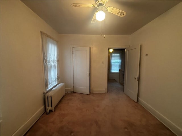 636 Lincoln Ave, East Liberty, PA 15206 - unfurnished bedroom with light carpet, radiator, and baseboards