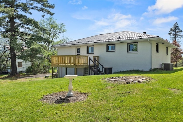 54 Devils Den Rd, Hanover Twp Wsh, PA 15021 - rear view of house with a lawn, a wooden deck, a standing seam roof, and central AC