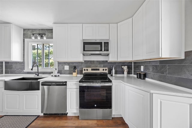 54 Devils Den Rd, Hanover Twp Wsh, PA 15021 - kitchen with white cabinets, light countertops, stainless steel appliances, and a sink
