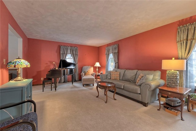 living room with light carpet and a textured ceiling